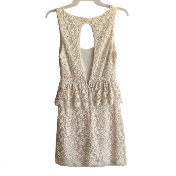 PINS & NEEDLES | Ivory Sleeveless Lace Cutout Back Peplum Mini Cocktail Dress - Picture 9 of 11